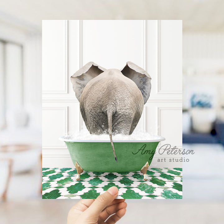 a hand holding a card with an elephant in a bathtub