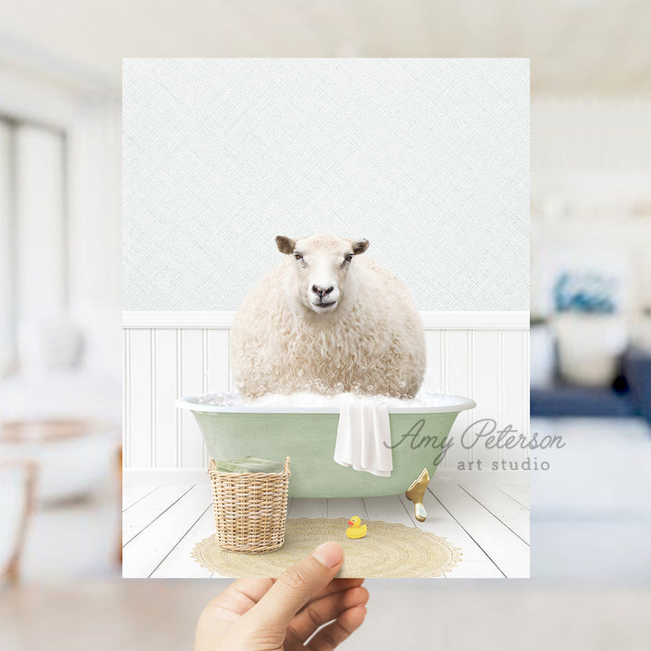 a person holding up a card with a sheep in a bathtub