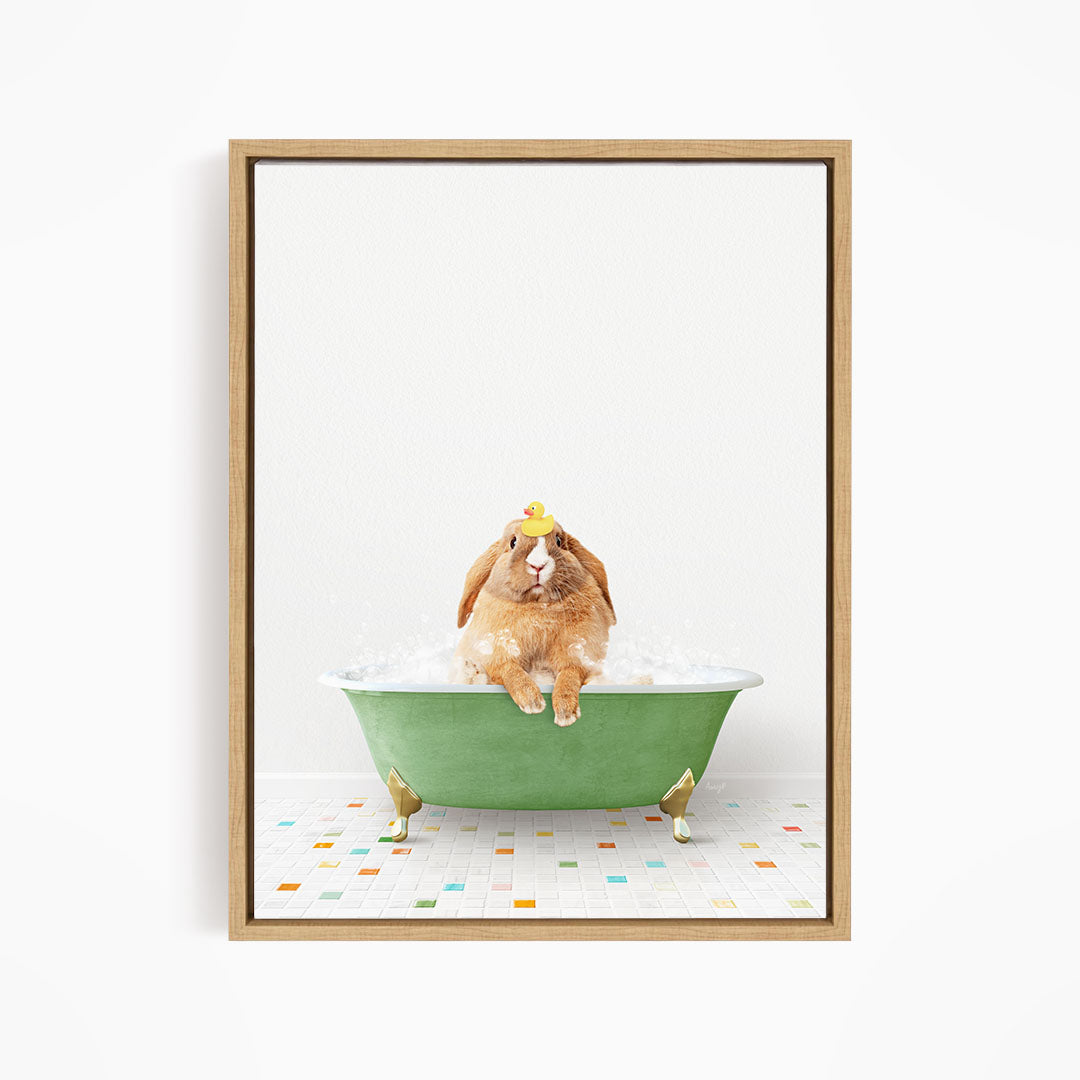 A brown rabbit sitting in a green bathtub filled with bubbles, wearing a yellow hat.