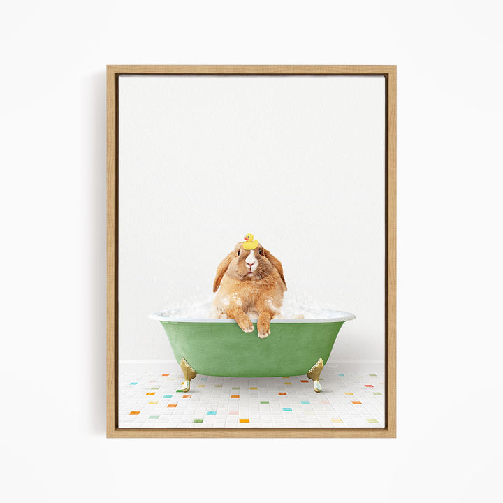A brown rabbit sitting in a green bathtub filled with bubbles, wearing a yellow hat.