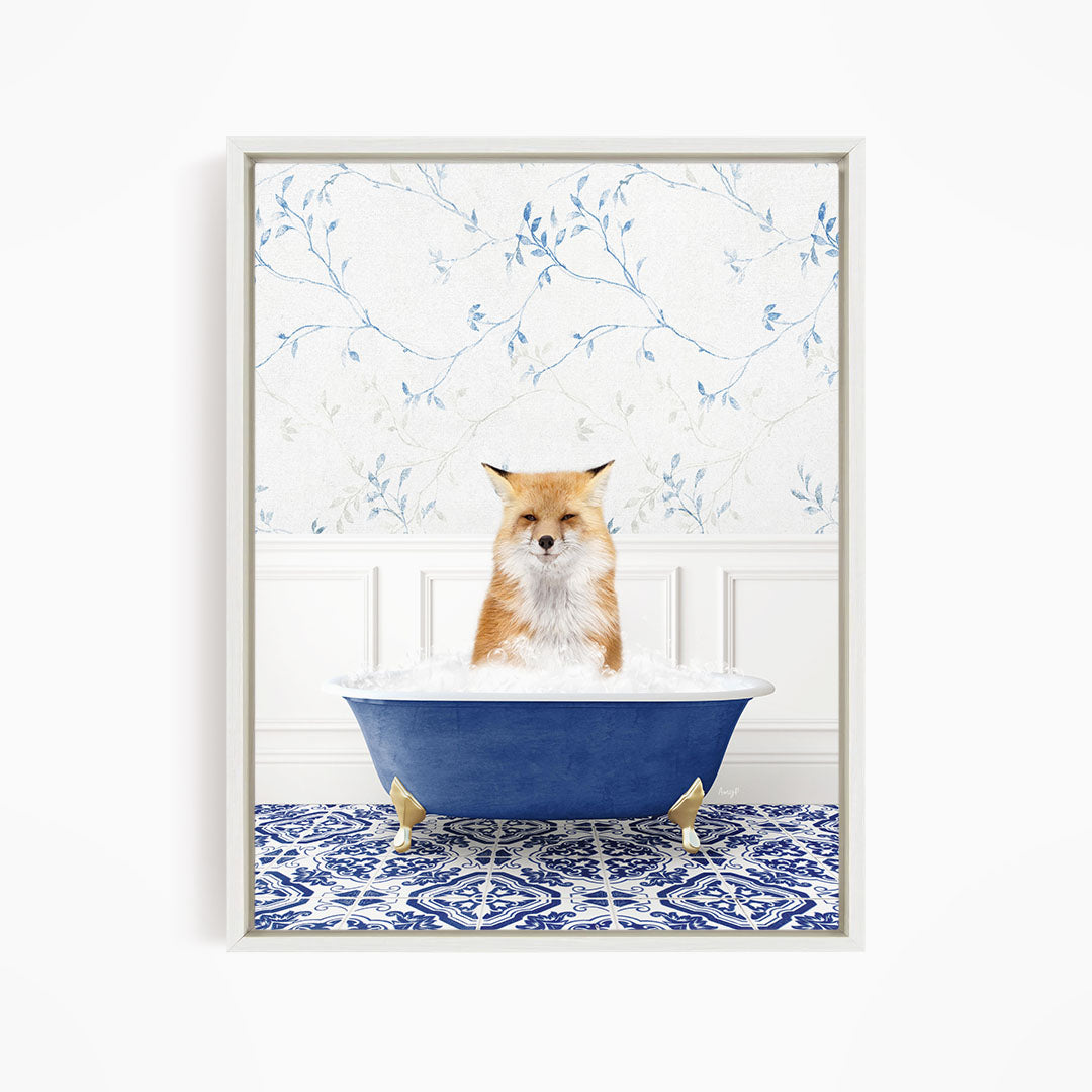 A red fox is sitting in a blue bathtub, with a blue and white patterned tile floor in the background.