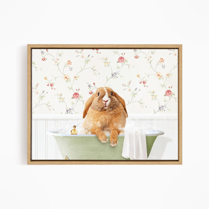 A brown rabbit sitting in a green bathtub filled with water, surrounded by a floral wallpaper.