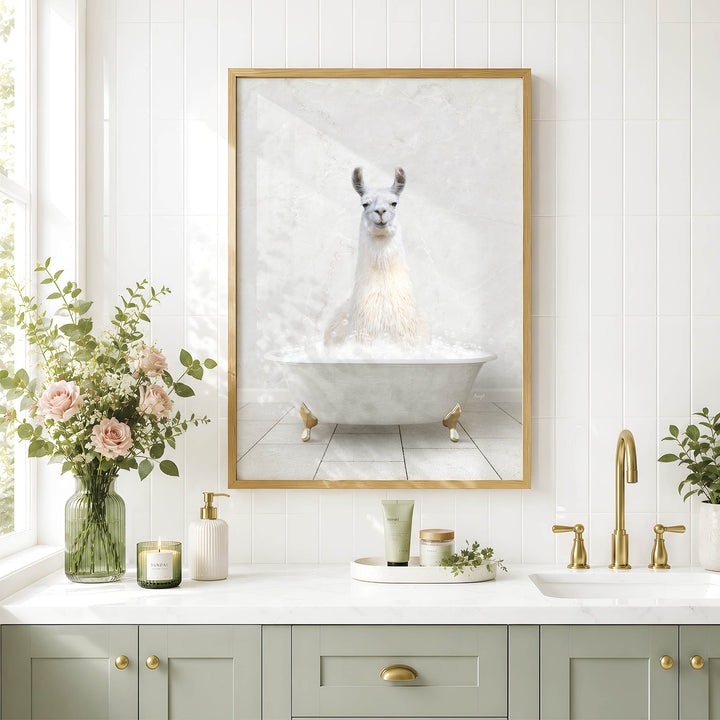 a bathroom with a framed picture of a white llama sitting in a bathtub, surrounded by flowers and candles.