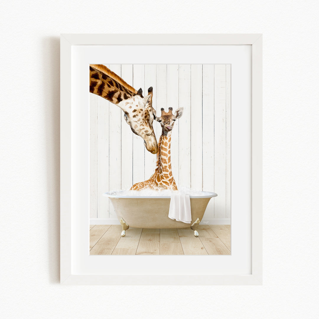A mother giraffe and her baby giraffe are sitting together in a bathtub, with the mother gently licking her baby.