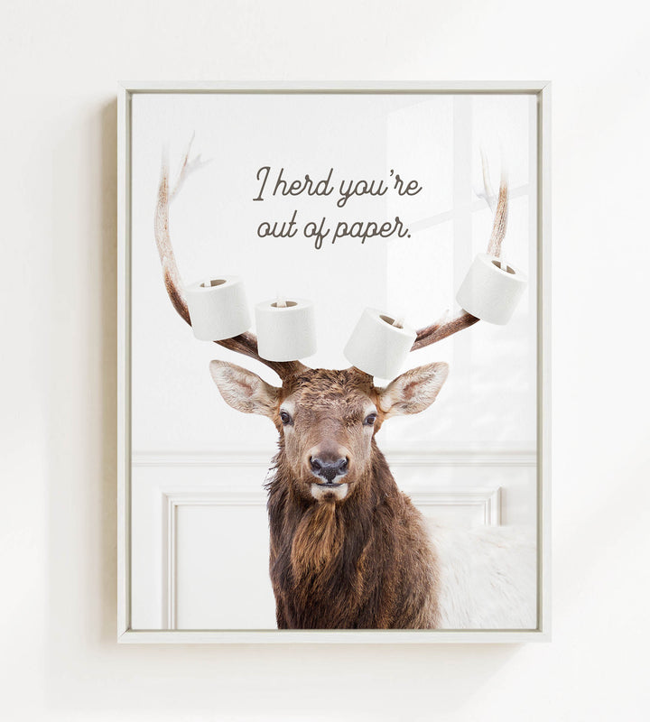 A deer with antlers holding multiple rolls of toilet paper, with the text "I herd you're out of paper" above it.