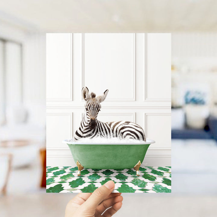 A zebra lying in a green bathtub filled with bubbles, surrounded by a green and white patterned floor.