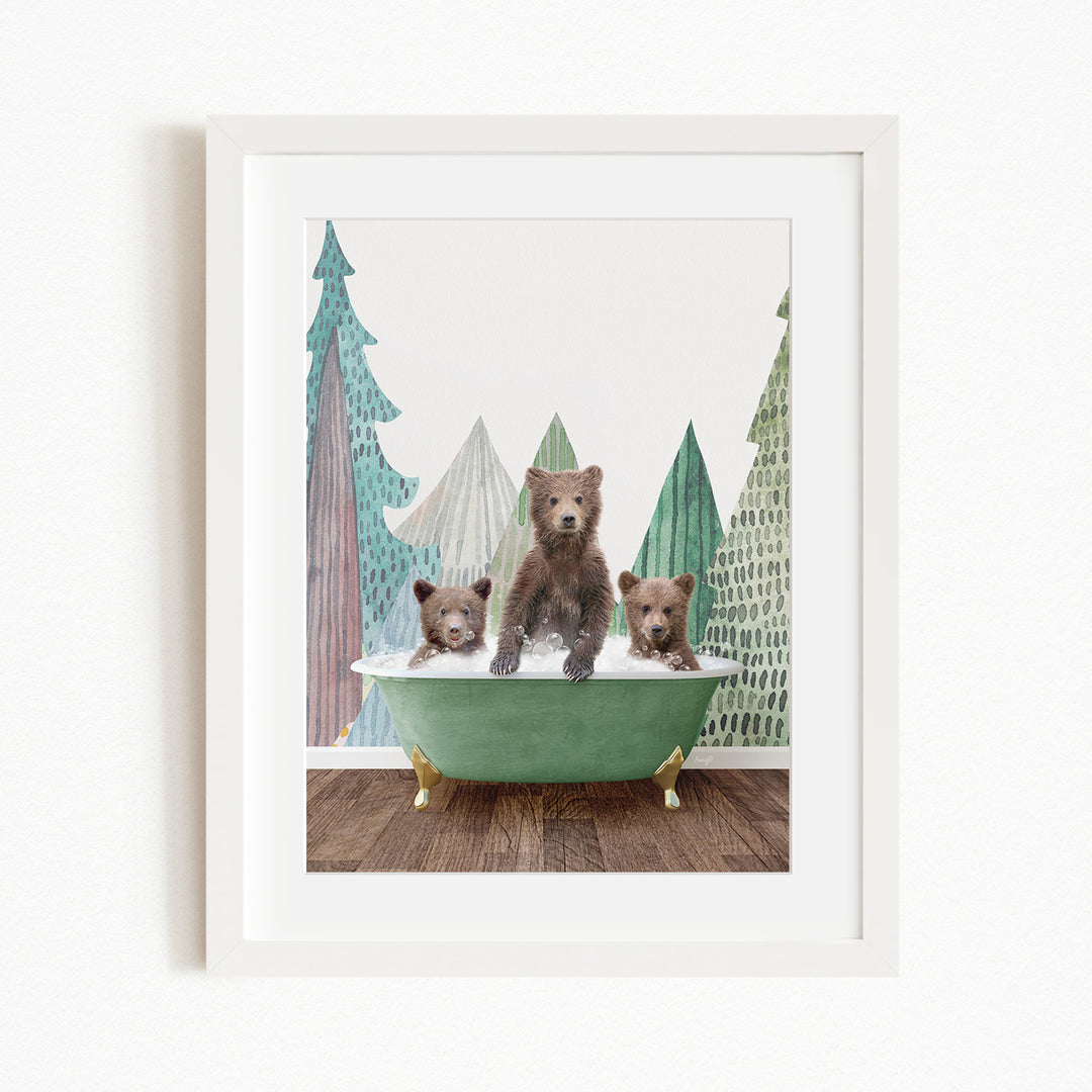 A framed image depicting three bears sitting in a green bathtub, with a forest scene in the background.