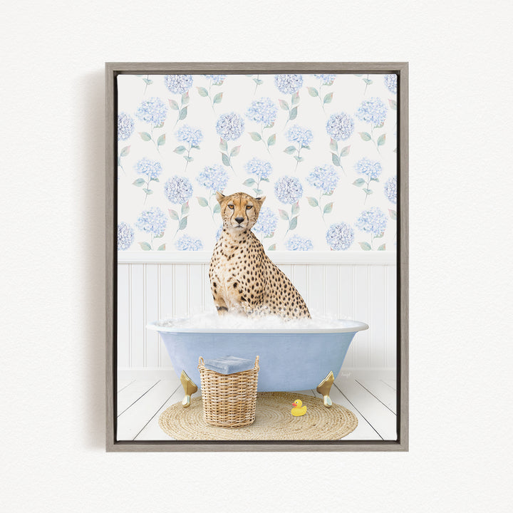 A cheetah sitting in a blue bathtub filled with water, surrounded by a wicker basket and a rubber duck.
