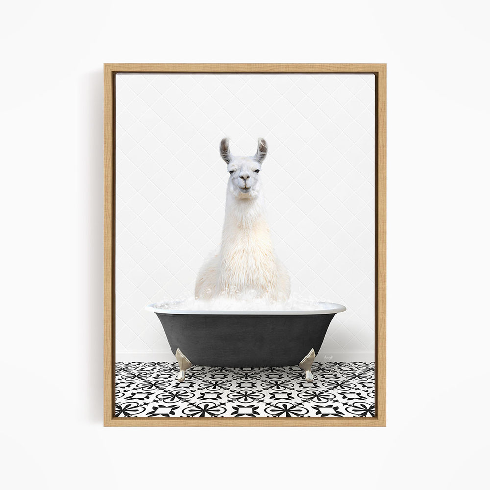 A white llama sitting in a black bathtub filled with water, surrounded by a black and white patterned tile floor.
