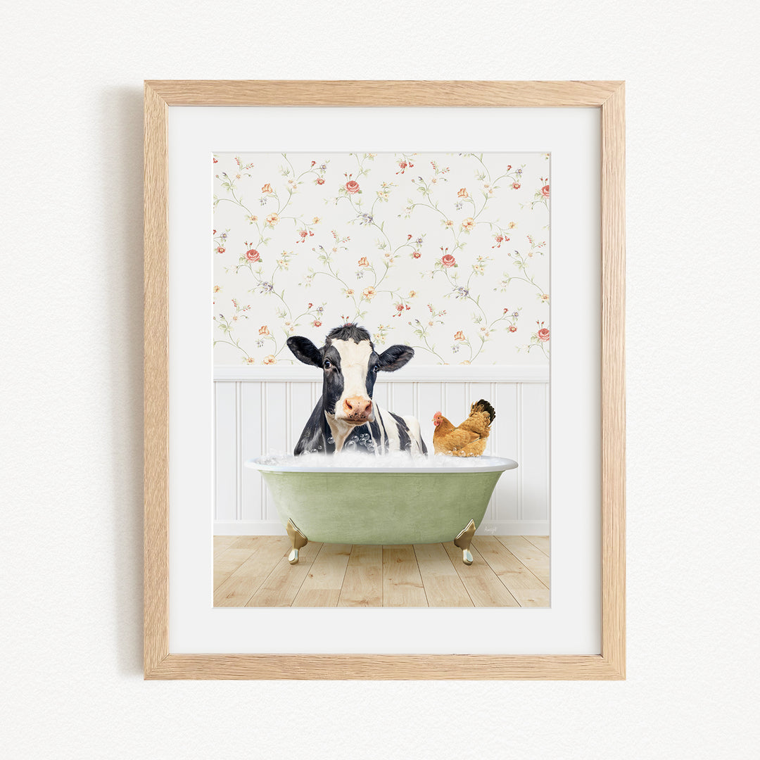 A black and white cow is sitting in a green bathtub, with a chicken standing nearby, against a floral wallpaper background.