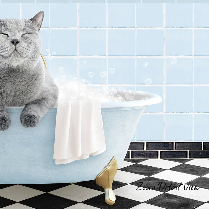 A gray cat sitting in a blue bathtub, surrounded by bubbles, with a black and white checkered floor in the background.
