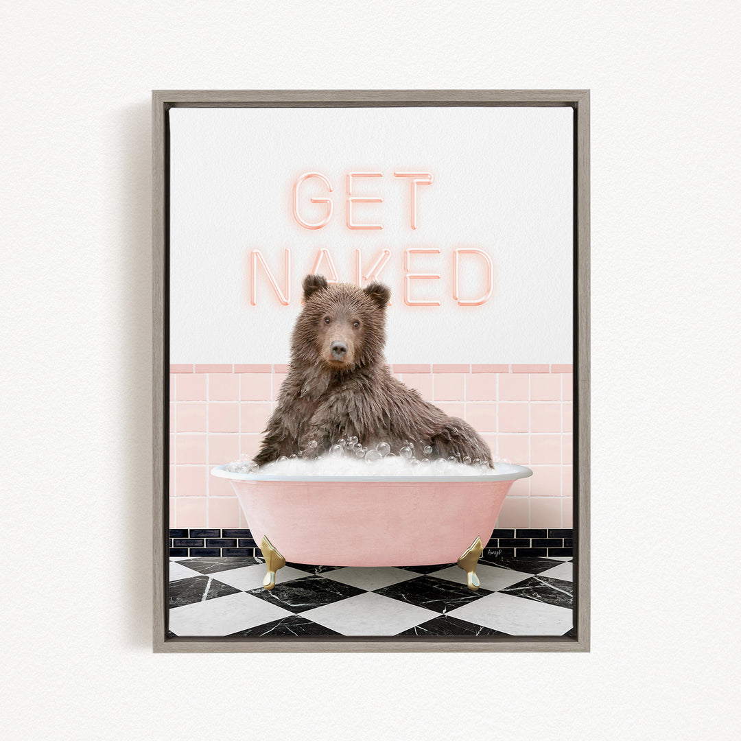 A brown bear sitting in a pink bathtub with the text "GET NAKED" displayed above it.