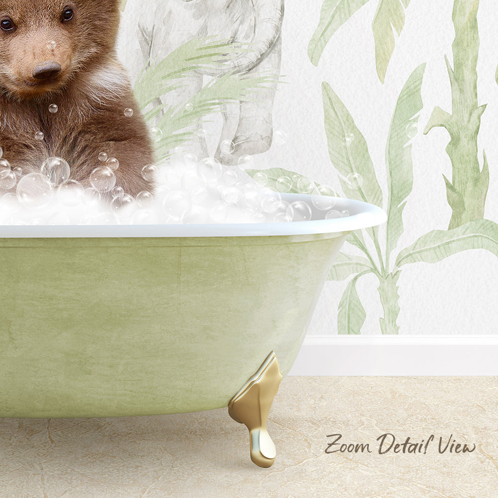 A brown bear is sitting in a green bathtub filled with bubbles, with a wall featuring a plant design in the background.