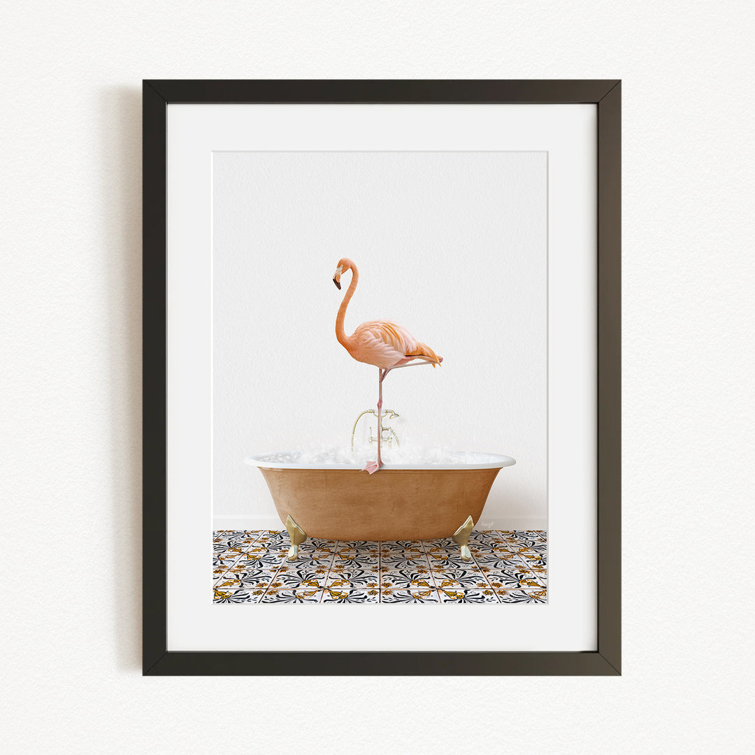 A framed image of a flamingo standing in a bathtub filled with water and bubbles.