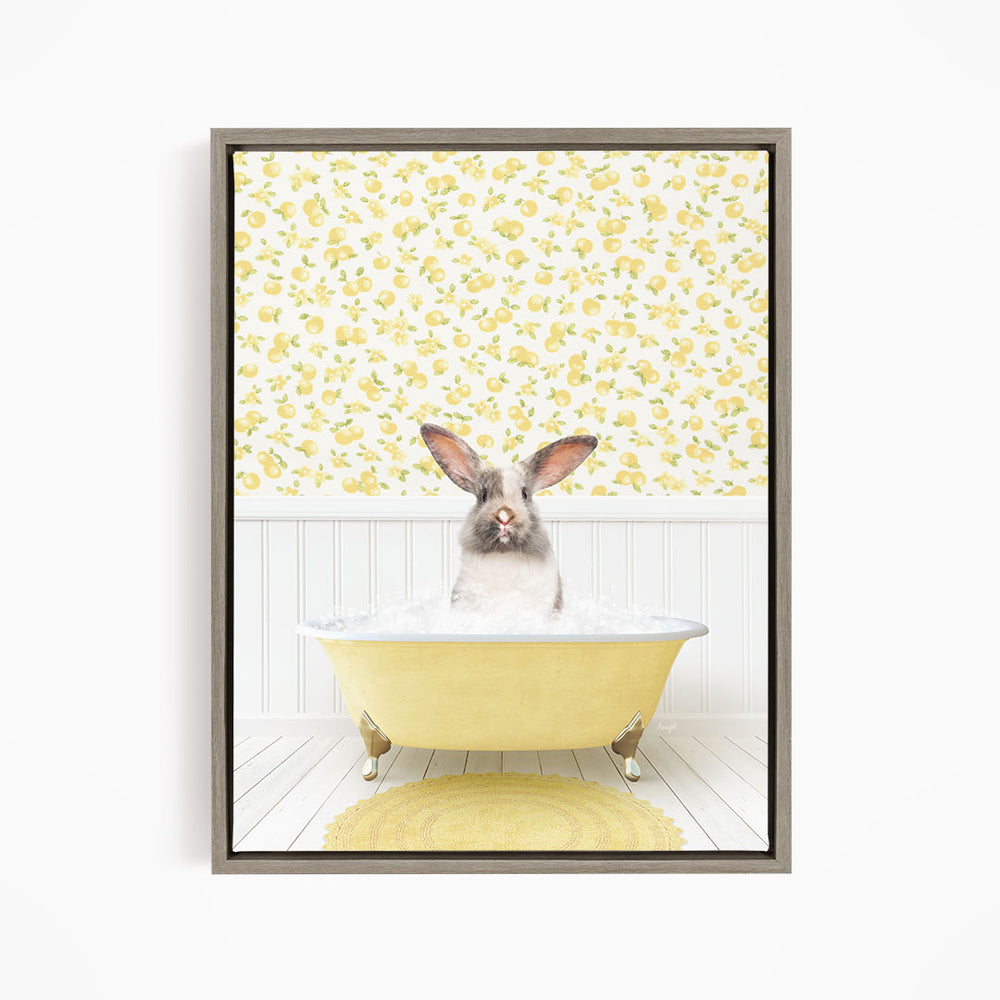 A cute rabbit sitting in a yellow bathtub filled with water, surrounded by a yellow floral wallpaper.