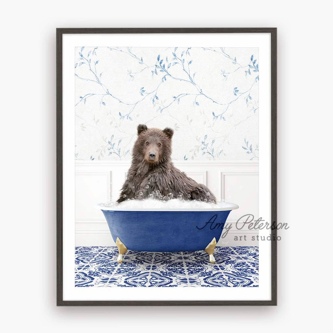 a brown bear sitting in a blue bath tub