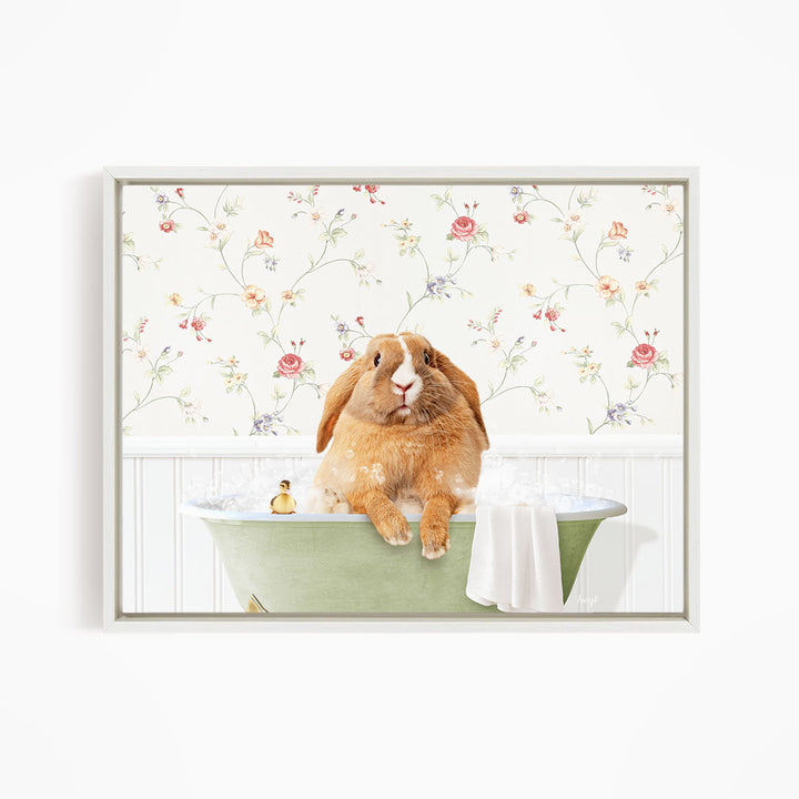 A brown rabbit sitting in a green bathtub filled with water, surrounded by a floral wallpaper.
