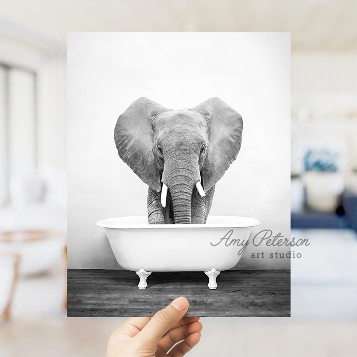 a black and white photo of an elephant in a bathtub