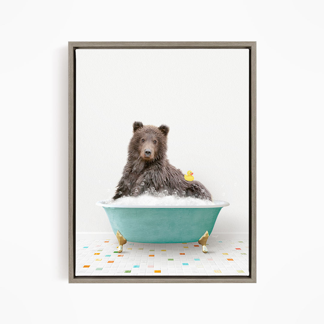 A brown bear sitting in a blue bathtub, with a yellow rubber duck floating on the water.