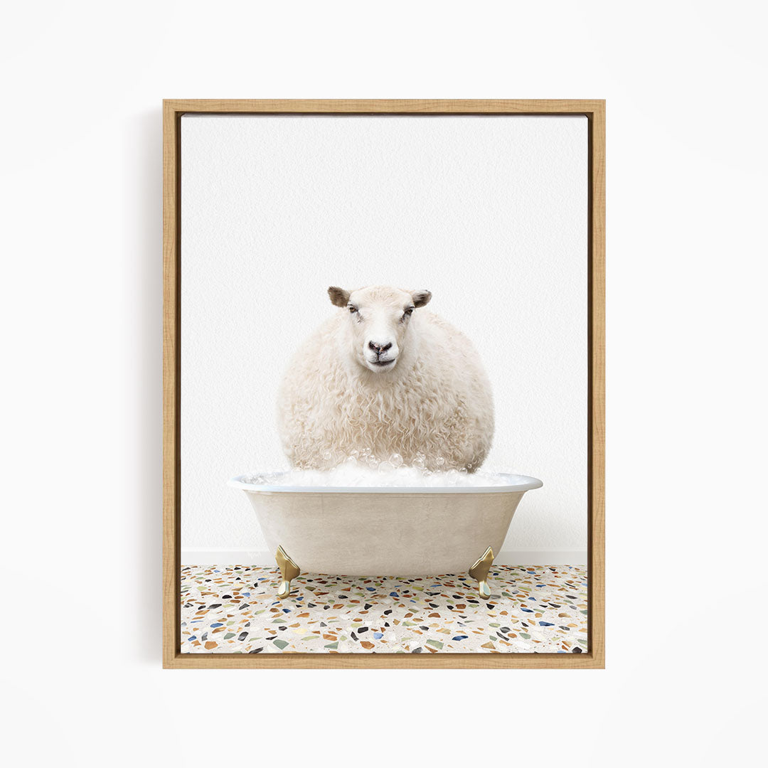 A fluffy white sheep sits in a white bathtub filled with bubbles, creating a whimsical and playful scene.