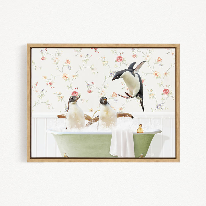 A framed image depicting three penguins sitting in a bathtub, with one penguin flying towards the others.