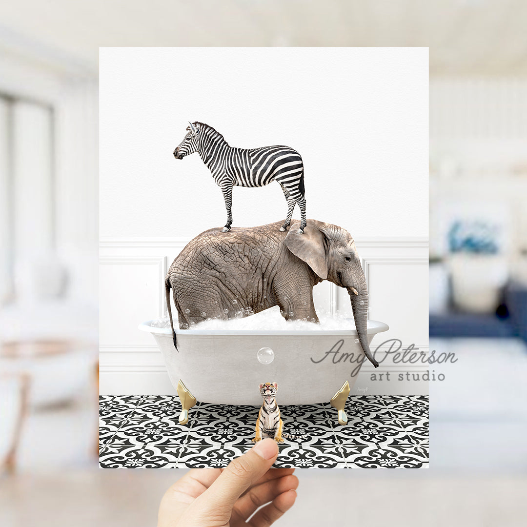 a person holding up a card with a picture of a zebra and an elephant on