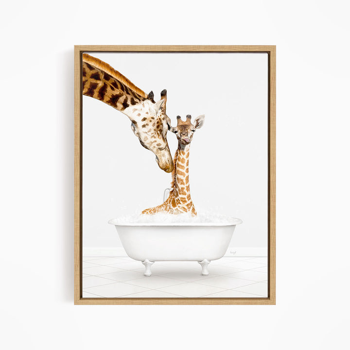 A mother giraffe and her baby giraffe are sitting together in a white bathtub, with the mother gently licking her baby.