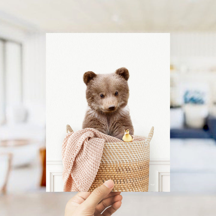 Bear Cub in Laundry Basket - Simple White Wall