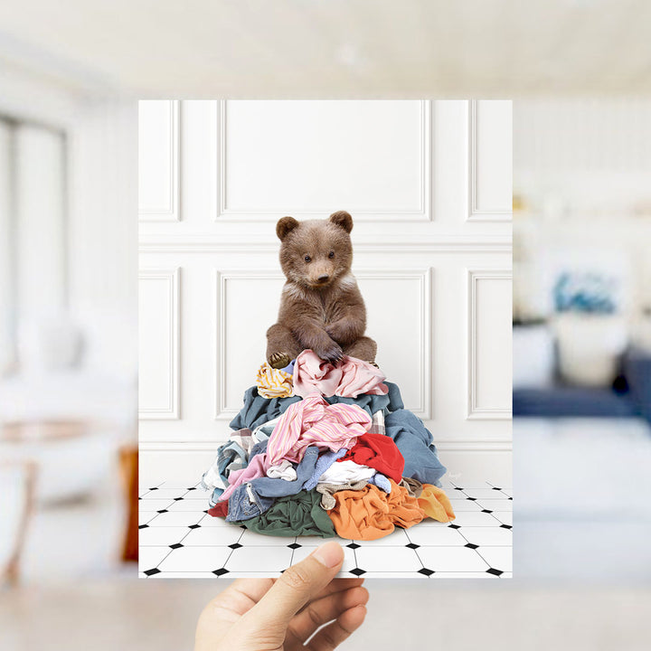 Bear Cub Sitting On Clothes Pile - Classic White Floor