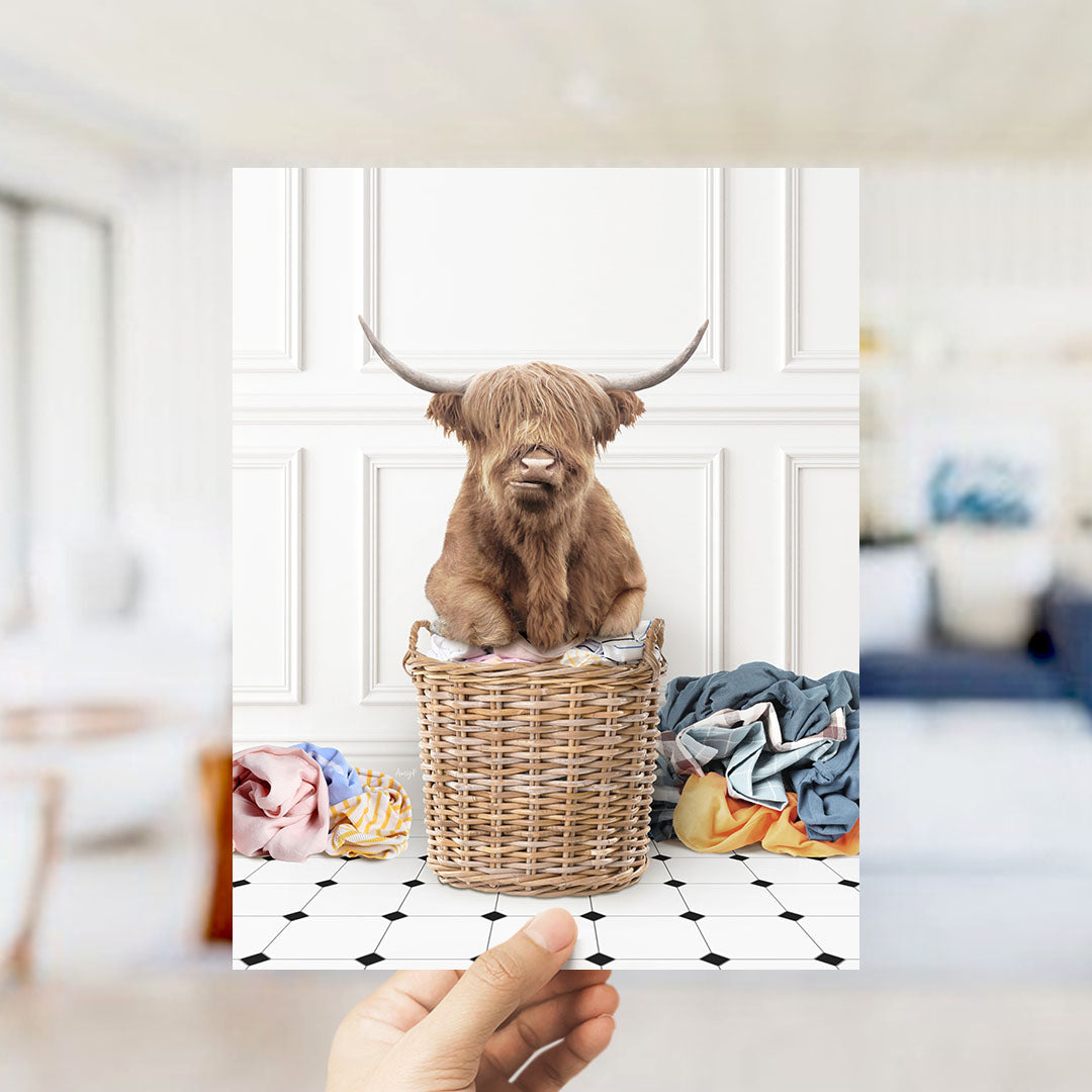 Highland Cow on Laundry Basket with Piles of Clothes - Classic White Floor
