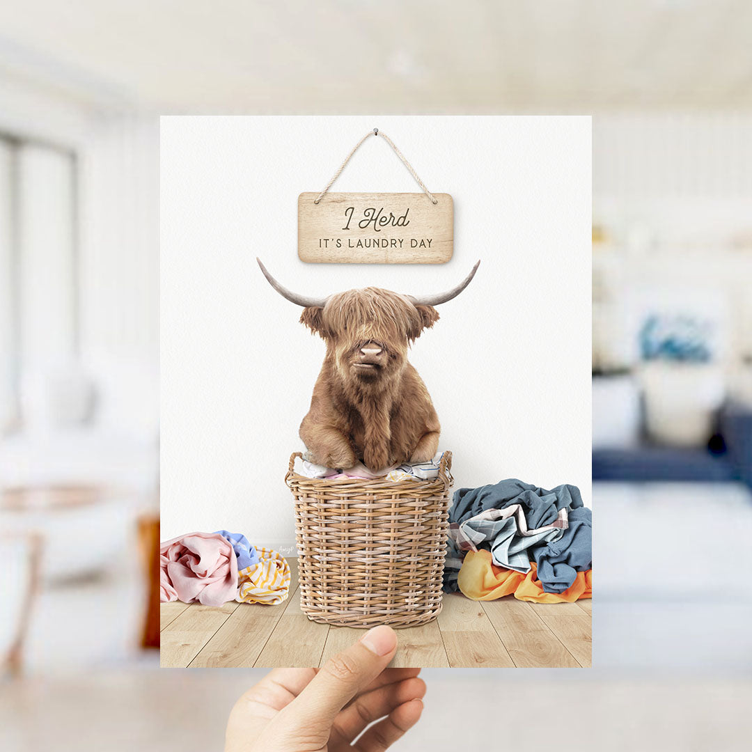Highland Cow on Laundry Basket with Clothes Pile - Scandi Floor