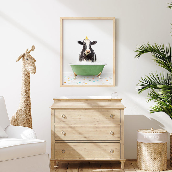 Black and White Cow in Green Bathtub on Colored Tile