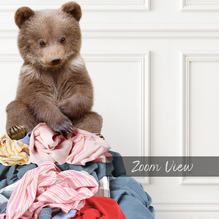 Bear Cub Sitting On Clothes Pile - Classic White Floor