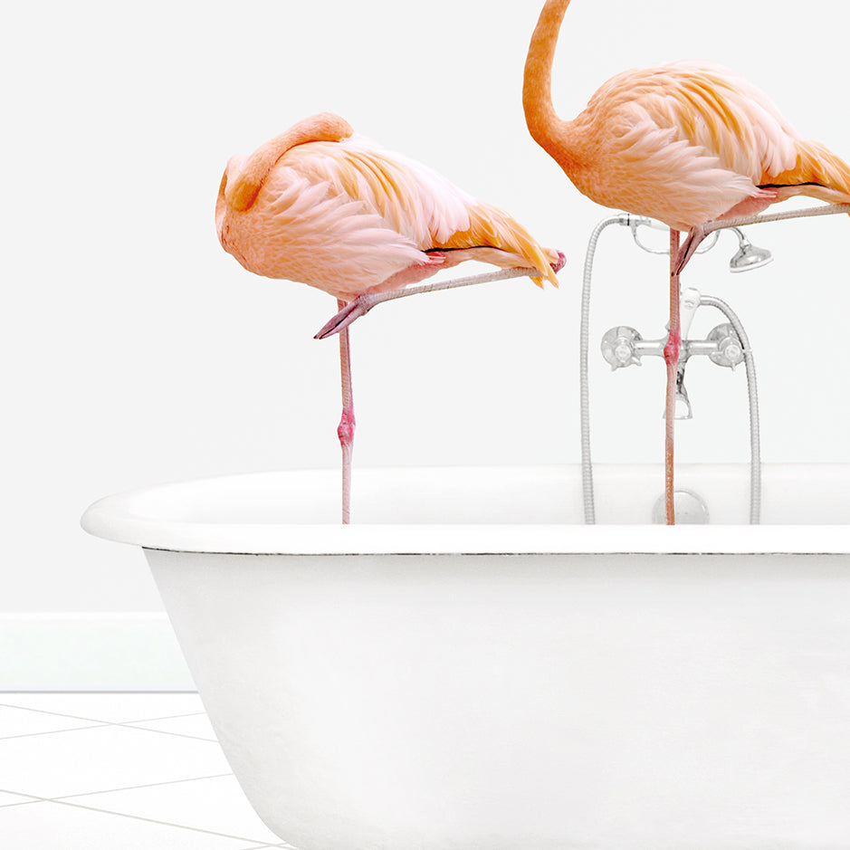 two pink flamingos are standing in a bathtub