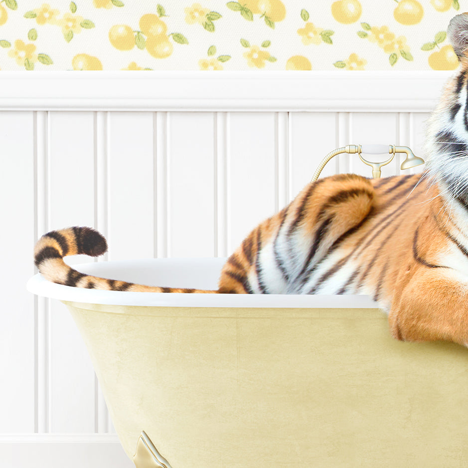 a stuffed tiger sitting in a bathtub