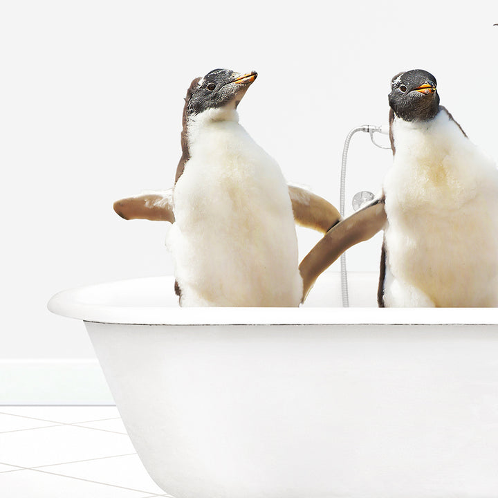 two penguins are standing in a bathtub