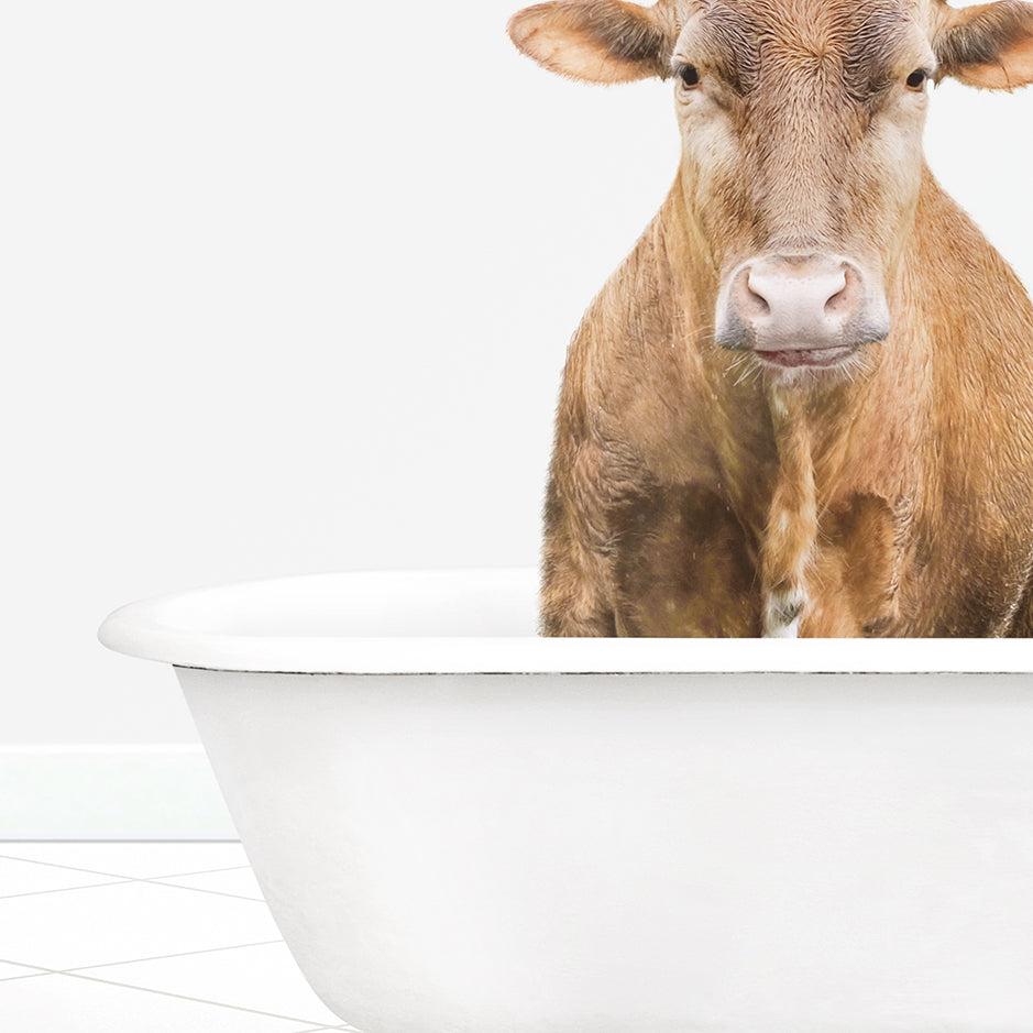 a brown cow standing inside of a bath tub