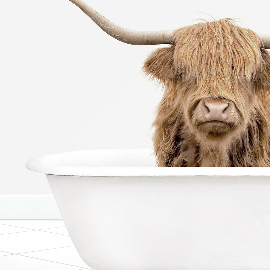 a cow with long horns is sitting in a bathtub