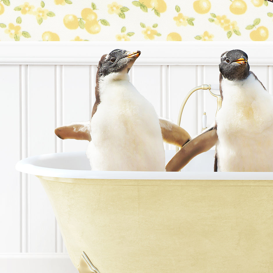 two penguins sitting in a bathtub with their heads turned to the side